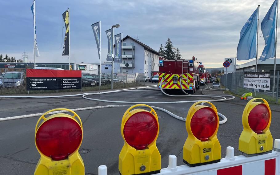 Barricades in the foreground and a fire truck ahead of the barricades