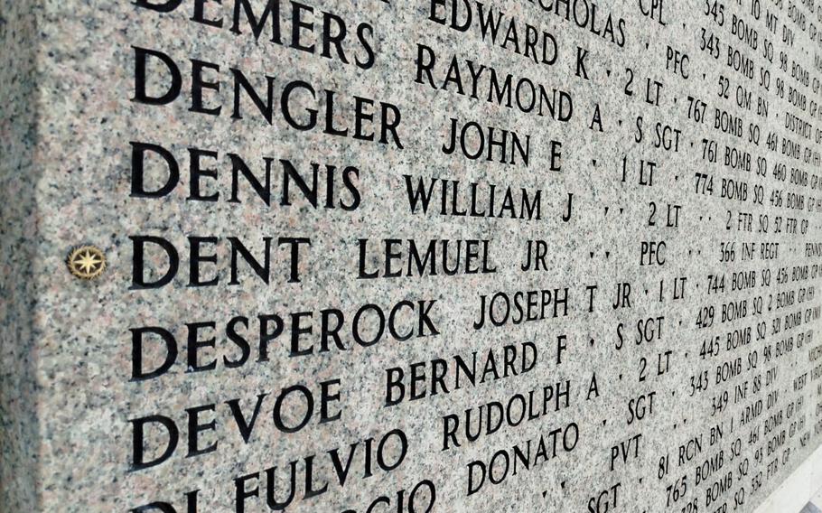 A rosette next to the name of Pfc. Lemuel Dent Jr. on the Wall of the Missing at Florence American Cemetery in Italy.