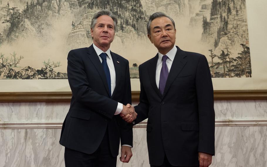 Chinese Foreign Minister Wang Yi, right, shakes hands with Secretary of State Antony Blinken during meetings in Beijing in June 2023.