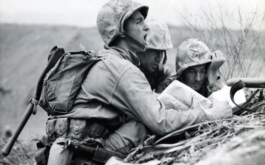 A group of Marines gather during World War II.