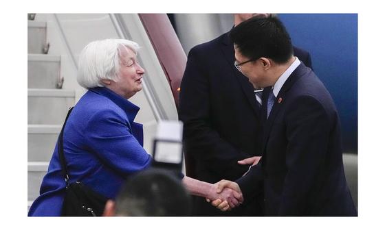 U.S. Treasury Secretary Janet Yellen, left, shakes hands with Chinese ...