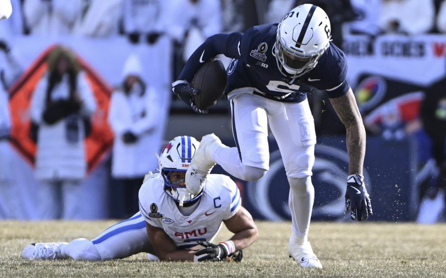 Harrison Wallace III breaks a tackle.