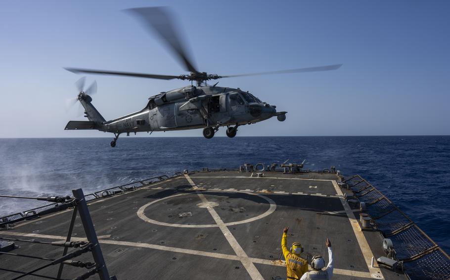 An HSC-7 helicopter lands on the USS Laboon in the Red Sea.