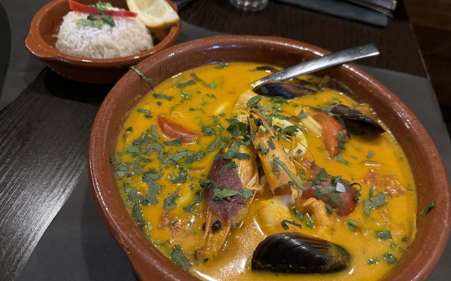 Sudado de Pescado, which translates to sweaty fish, is a tangy Peruvian fish stew. The Mi Peru version is tenderly cooked hake fillet in an onion and tomato sauce, accompanied by mussels, squid and prawns and served with rice.