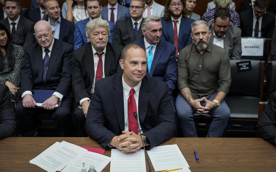 David Grusch, former National Reconnaissance Officer Representative of Unidentified Anomalous Phenomena Task Force at the U.S. Department of Defense, takes his seat as he arrives for a House Oversight Committee hearing on Capitol Hill, July 26, 2023, in Washington. 