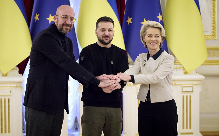 Ukrainian President Volodymyr Zelenskyy, center, European Commission President Ursula von der Leyen, right, and European Council President Charles Michel shake hands during the EU-Ukraine summit in Kyiv, Ukraine, on Feb. 3, 2023. 