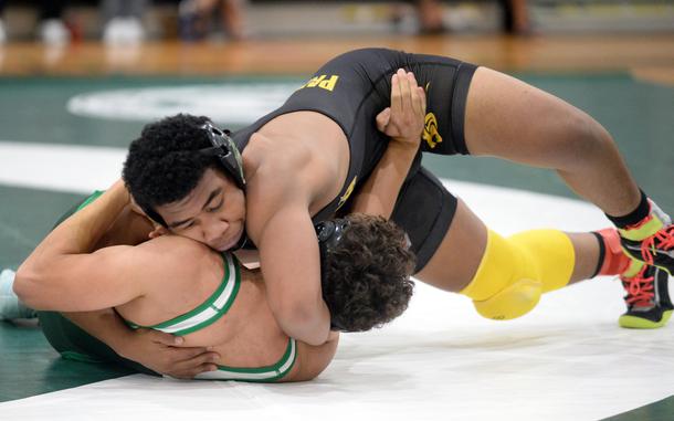 Kadena's Josiah Drummer, top, is one of four two-time defending Far East tournament champions wrestling Saturday in the 10th Rumble on the Rock.