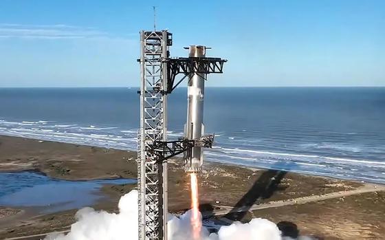 A SpaceX Starship Super Heavy booster makes a successful return, caught at the launch tower in Boca Chica, Texas, on Thursday, Jan. 16, 2025. (SpaceX/TNS)