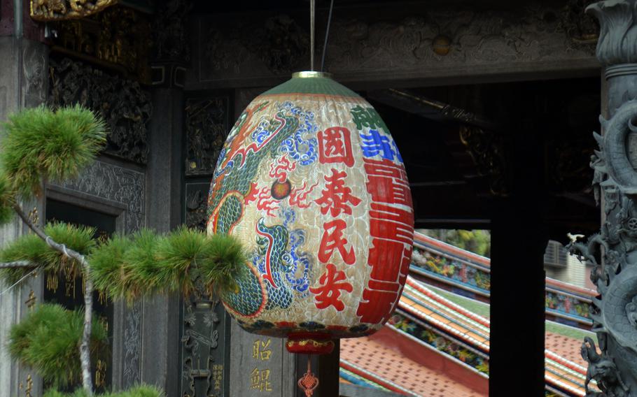 Lungshan Temple in Taipei, Taiwan, rises above an array of colorful lanterns.