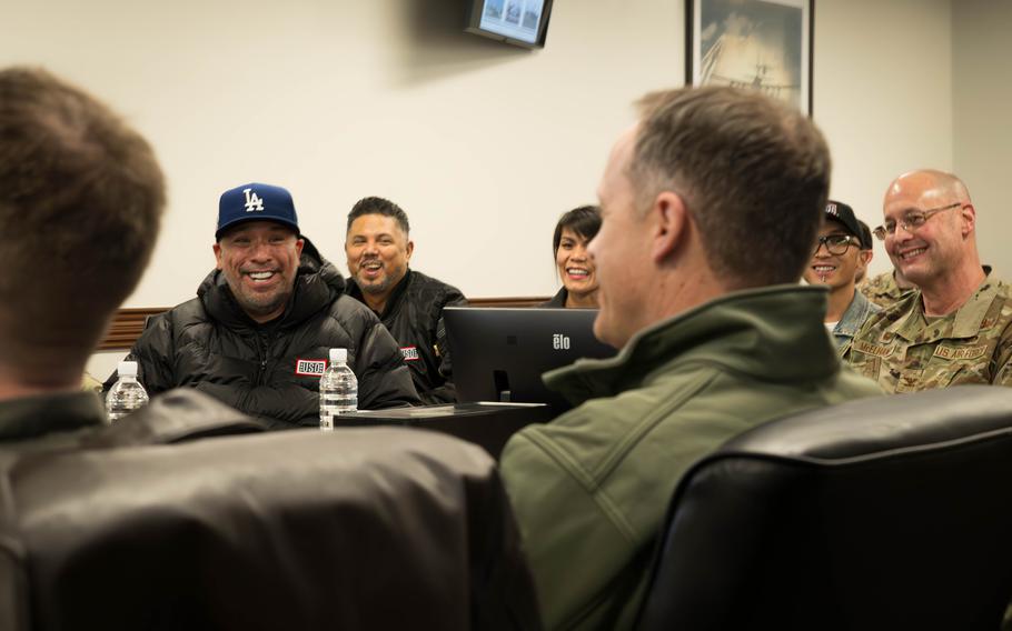 Jo Koy, left, receives a mission briefing from U.S. Air Force Col. Richard McElhaney,