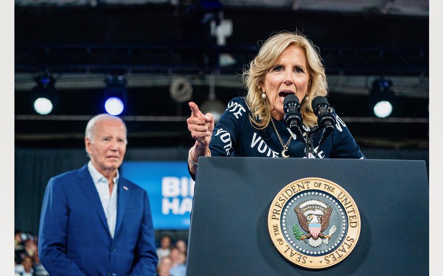 First lady Jill Biden speaks as President Biden stands behind her during a campaign event in North Carolina on Friday, June 28, 2024.