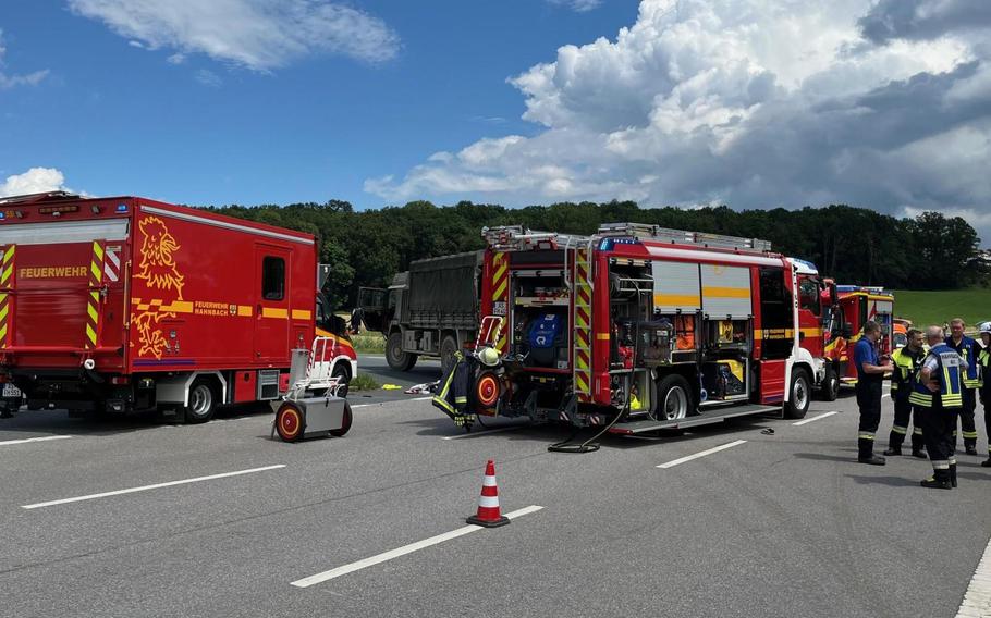 Fire rescue units respond to the scene of a fatal crash between a British military vehicle and a German motorcycle.