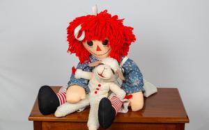 Raggedy Ann, a unique and kind doll, would probably be fun to hang out with.