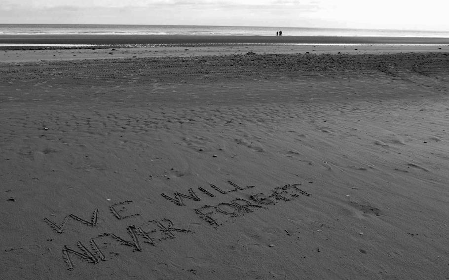 Someone left the message "We will never forget" for the veterans of D-Day on Omaha Beach on the anniversary weekend of the 70th anniversary of D-Day in 2014.