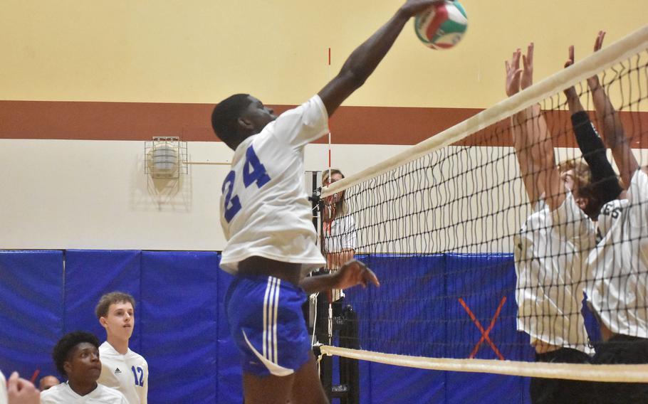 Hohenfels’ Joel Idowu skies over the net to send the ball towards a Naples block during pool-play action Thursday, Oct. 26, 2023, at the DODEA-Europe boys volleyball championships.