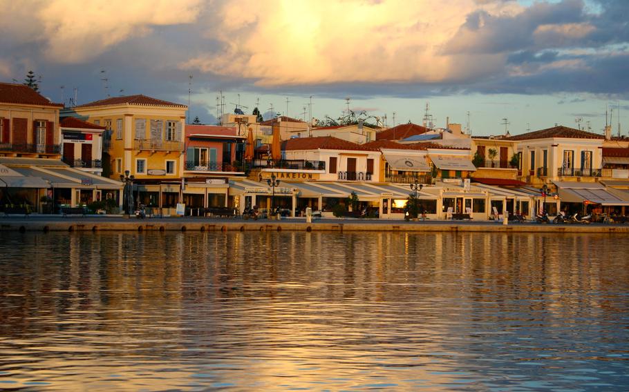 Shops and cafes line the port in Aigina town on the Greek island of Aigina. The islands is known for its pistachios, which are sold in abundance in the harbor's shops.