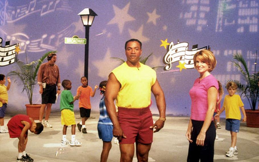 A promotional poster for the children&#39;s exercise video Movin&#39; & Groovin&#39; shows Air Force Staff Sgt. Tony Webb and aerobics instructor Linda Harris posing on one of the sets they used to lead a series of exercise routines.