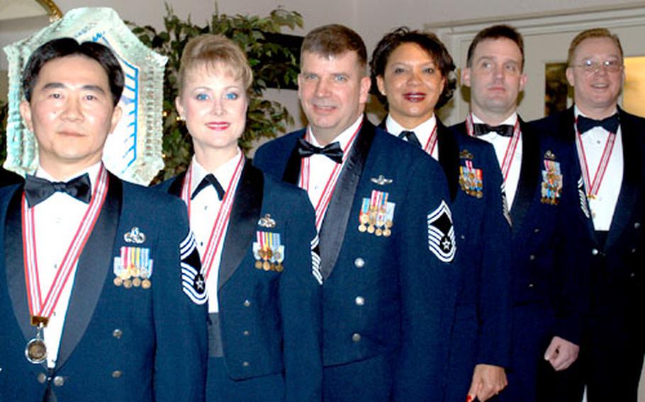 Yokota Air Base’s new chief master sergeants for 2003 were inducted at a ceremony on base Jan. 25. They are, left to right: Susumu Cherrix, Marjorie McNichols, Jeffrey Cowardin, Dianne Bowe, Charles LaFleur and Kevin Van Gordon.