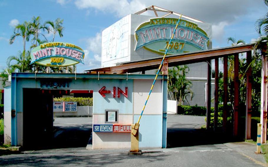 The kiosk at the entrance to The Mint House has a bank of TV screens that display the various room themes.