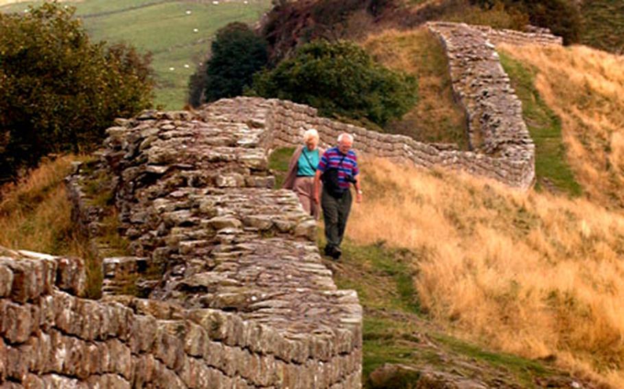 Hadrian&#39;s Wall snakes across hillsides near Cawfields, England, where walkers find the view worth the effort.