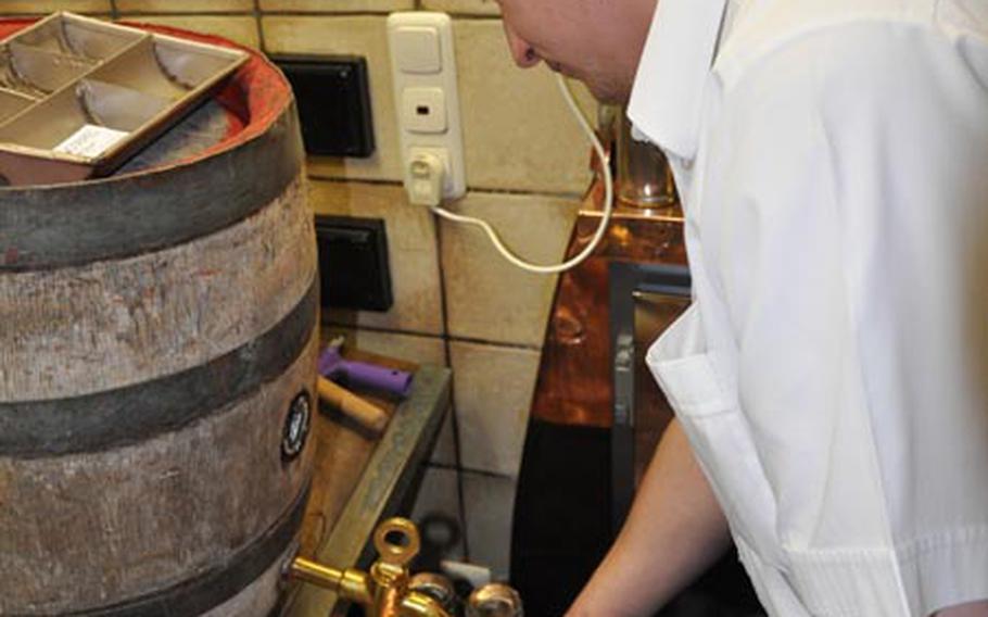 A bartender at the Schlenkerla fills several glasses of the brewery’s famous Rauchbier, or smoke beer, from a wooden keg, which is an age-old tradition for the brewery.