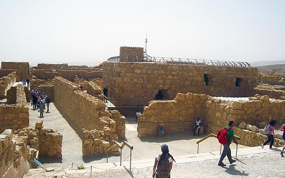 The Masada ruins include mazes of sandstone corridors and walls marking the outline of storerooms and living quarters. Ruins ranging from bath houses to palaces are scattered around the top of the mesa in the Judean Desert.