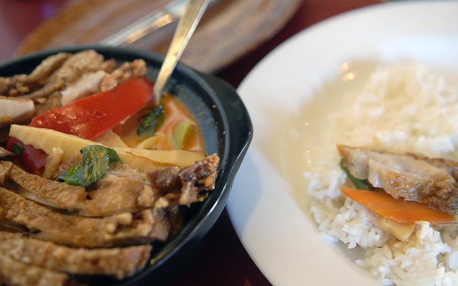 My favorite dish at Khao Lak in Mehlingen, Germany, is the gaeng gari gai, pieces of fried chicken over vegetables with a yellow curry, coconut milk sauce.