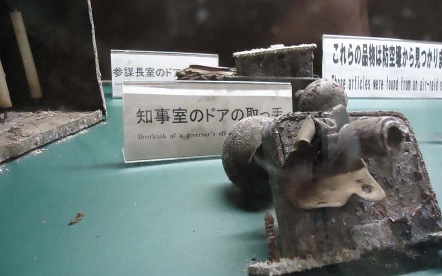 In a display case in one of the Tateyama Air-raid Shelter's empty rooms, lies the doorknob to Nagasaki prefecture Gov. Wakamatsu Nagano's shelter office, which was unearthed many years later. 