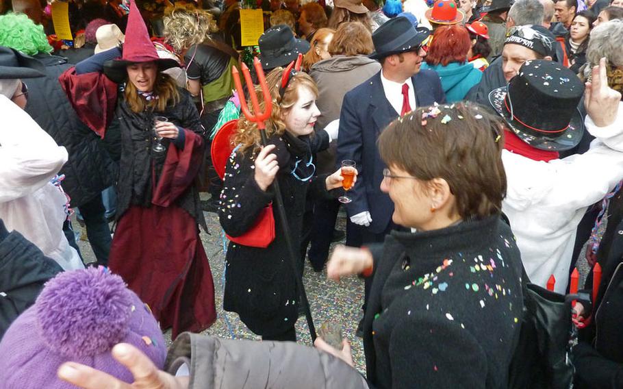 Confetti and costumes help set the mood for revelers on the streets of Munich during the city's Fasching celebrations. The crazy Carnival season goes by many names in Germany: Fastnacht, Karneval, Fassenacht, Fasnet and Fasching.