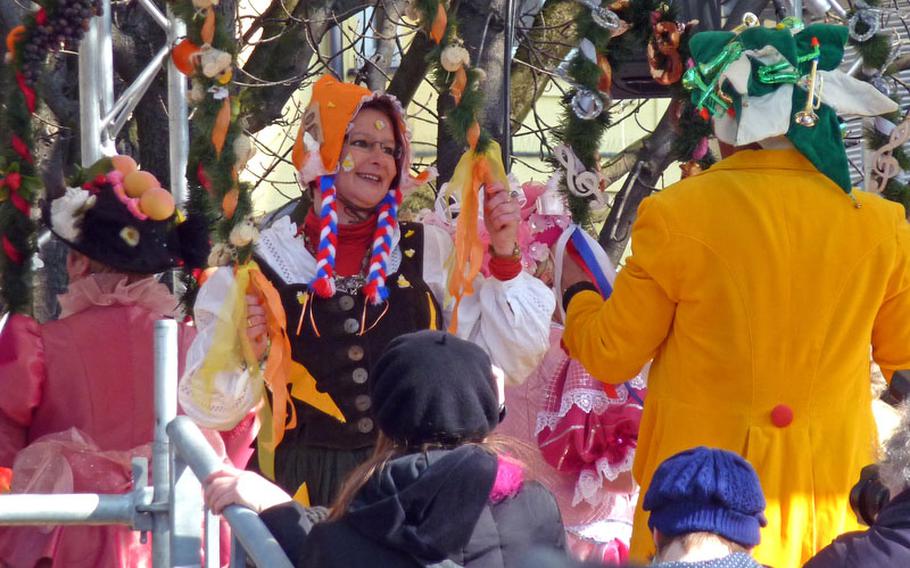 The market women of the Viktualienmarkt, Munich's downtown outdoor market, dance on Fat Tuesday last year. It is the highlight of the Munich Carnival celebrations.