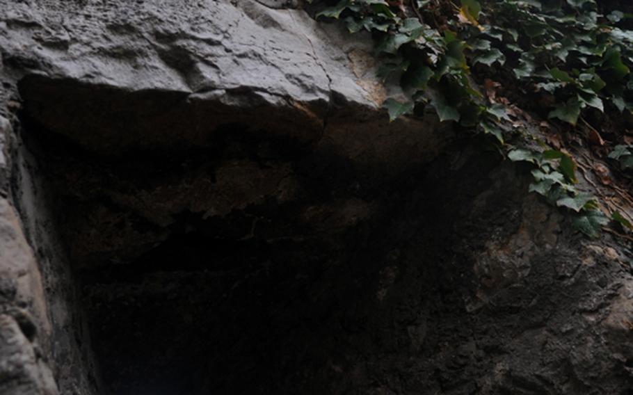 One of the few remaining walls of the Hofen castle ruins contains a slit where guards could defend the castle from behind the walls.