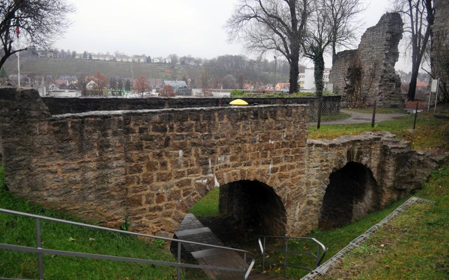 Stairs leading under a bridge and into a ditch that was once a moat used for controlling access to the Hofen castle in Stuttgart, Germany. While there isn&#39;t much remaining of the original structure, the ruins provide an opportunity to explore a bit of the area&#39;s history.