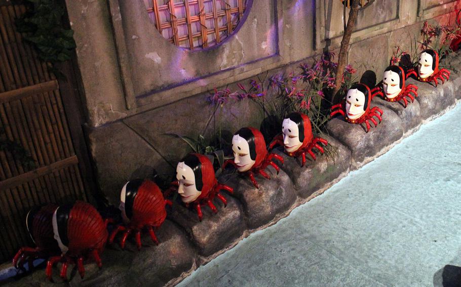 These "spiders" with human heads at Namjatown in Tokyo might just march into your nightmares.