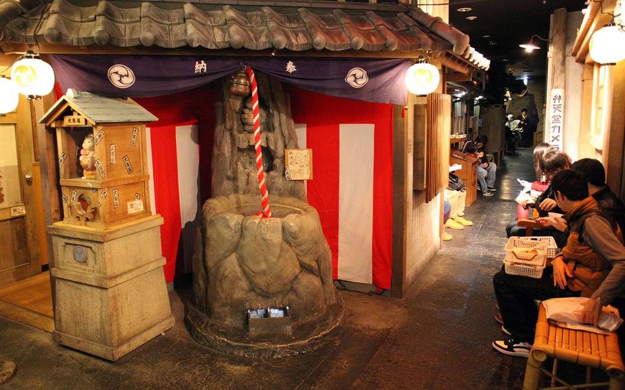 One of the many eating areas at Namco Namjatown in Tokyo. Much of the park is decorated in a traditional Japanese style.