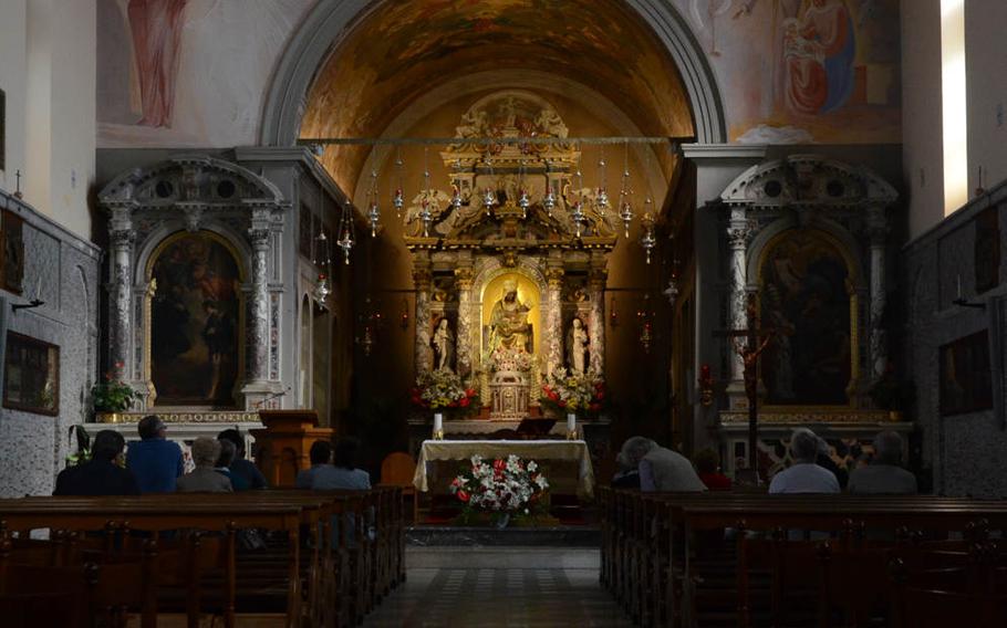 The centerpiece of the Sanctuary of Castelmonte is a 15th century painted stone sculpture of Mary holding a child, which is said to be the heart of the small hamlet near the town of Cividale, Italy.