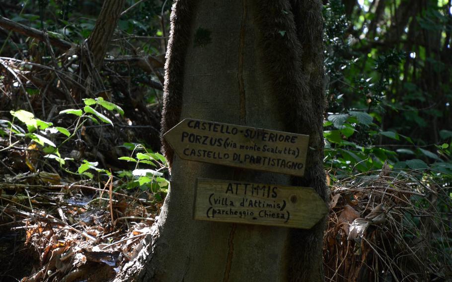 A sign on the hiking trail near Attimis, Italy, directs you to three castles: Attimis Superior, Attimis Lower and Partistagno.