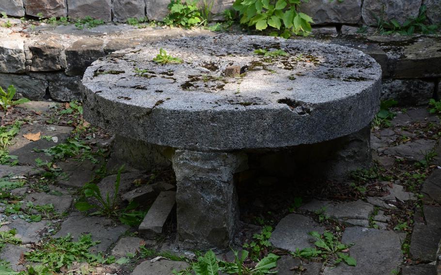 What appears to be an old stone table sits in an inner courtyard of Attimis Superior, a small castle located in the hills above Attimis, Italy.