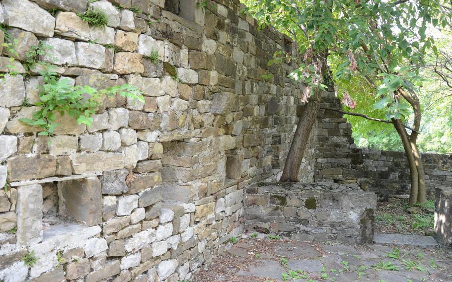 The inner courtyard of Attimis Superior is still full of life, with trees spread throughout the castle's grounds near Atttimis, Italy.