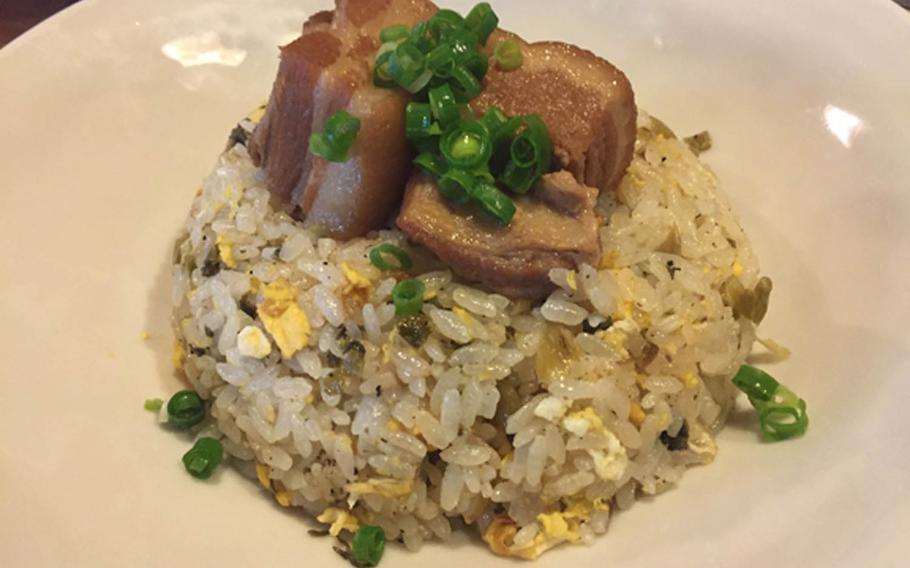 Sui Dunchi's pork-fried rice reaches stratospheric heights with its fresh vegetables and Agu pork topping.