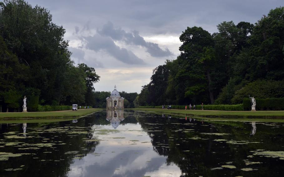 A man-made pond leads to a Baroque pavilion at the Wrest Park country estate in in Silsoe, Bedfordshire, England. The pavilion, used for banqueting, was designed by Thomas Archer and completed in 1711.