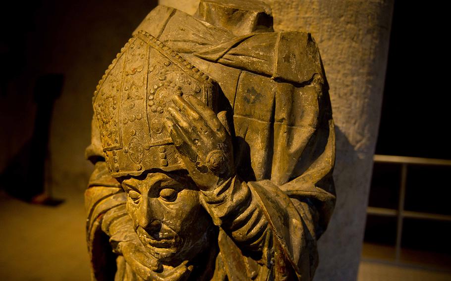 A statue of St. Denis from the medieval period is displayed in the Chevremont Granary.