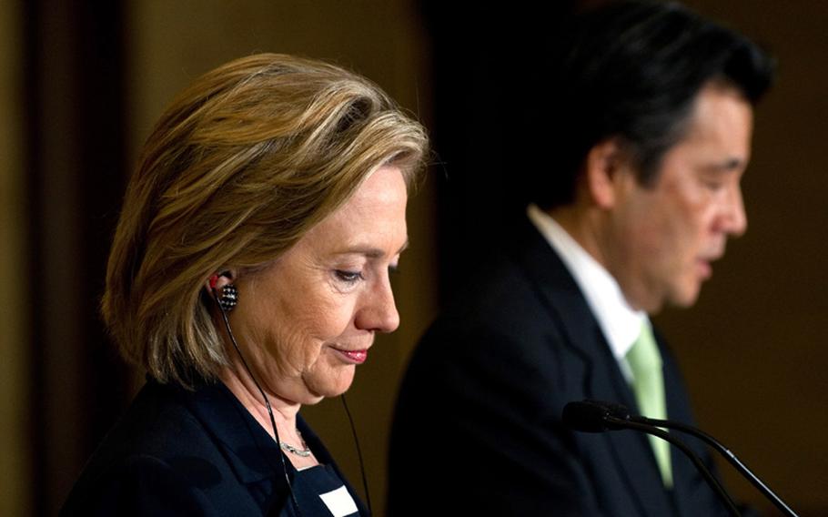 Japanese Foreign Minister Katsuya Okada, right, and U.S. Secretary of State Hillary Rodham Clinton hold a joint press conference May 21 following meetings at the Iikura Guest House in Tokyo.
