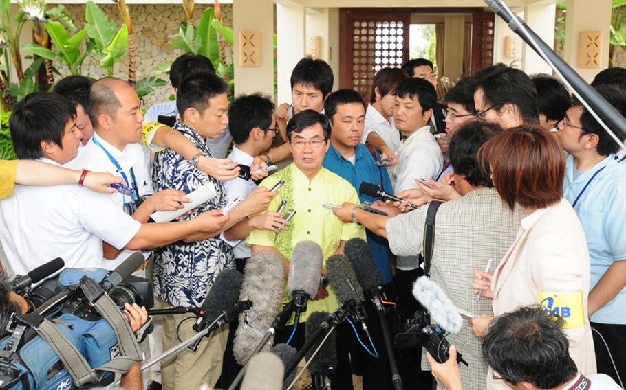 Mayor Susumu Inamine of Nago, where Camp Schwab is located, talks to reporters after a meeting with Prime Minister Yukio Hatoyama at the Busena Resort Conference Center in Nago on Sunday. He told reporters, that the mayors were united in their resolve to continue fighting against the relocation of Marine Corps Air Station Futenma.