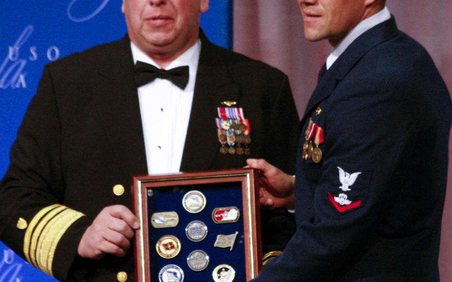 Coast Guard Chief of Staff Vice Adm. John P. Currier and USO Coast Guardsman of the Year Robert D. Emley.