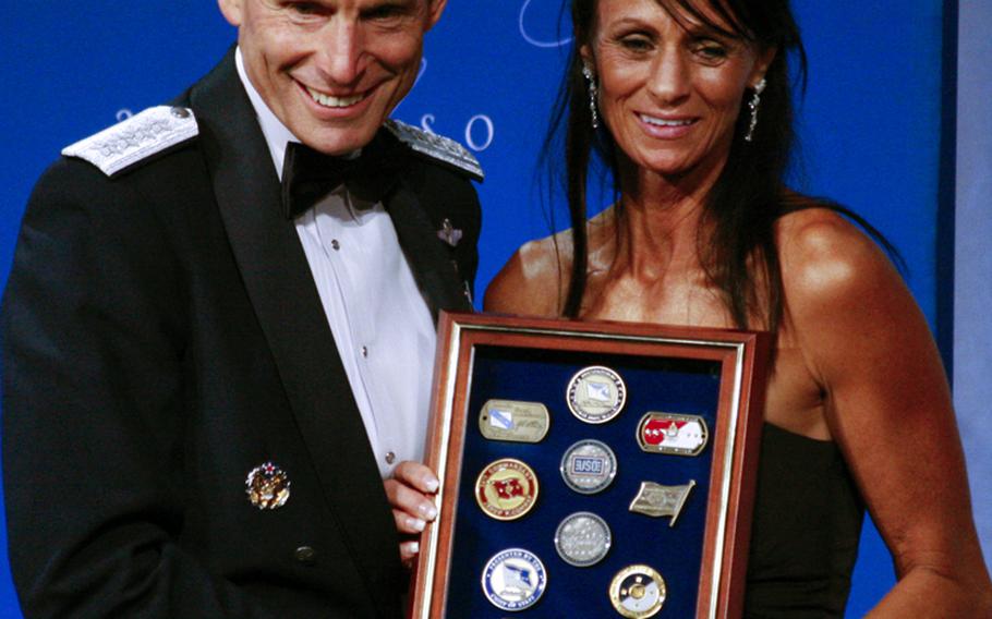 Air Force Chief of Staff Gen. Norton Schwartz and Kimberly Watkins, mother of USO Airman of the Year Staff Sgt. Gino P. Kahaunaele.