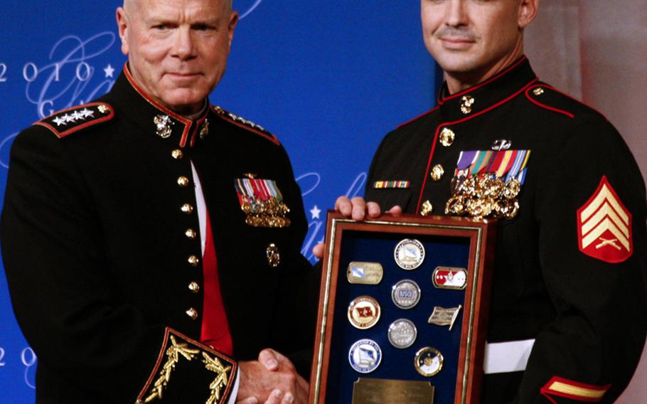 Assistant Marine Corps Commandant Gen. James Amos with USO Marine of the Year Sgt. Eric B. Walker.