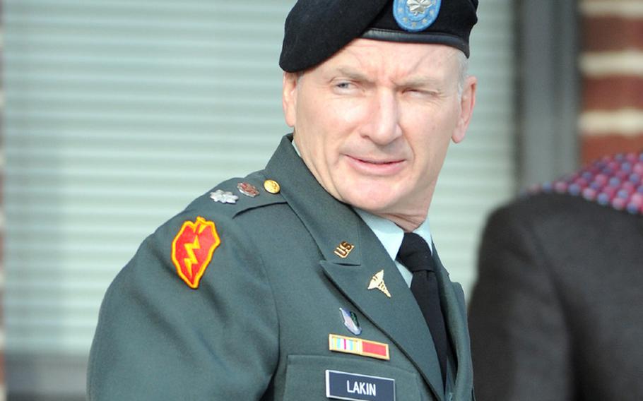 Army Lt. Col. Terrence Lakin of Greeley, Colo. leaves a military court during a break in his court-martial proceeding Tuesday, Dec. 14, 2010 at Fort Meade, Md. 