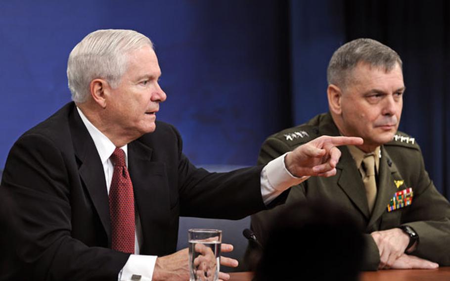 Defense Secretary Robert Gates and Gen. James Cartwright attend a news conference April 21.