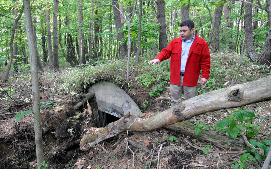 Richard Clark, 35th Fighter Wing historian, explains Thursday how a couple of airmen accidentally discovered what is believed to be a World War II-era,  Japanese military bunker in the woods on Misawa Air Base, Japan.