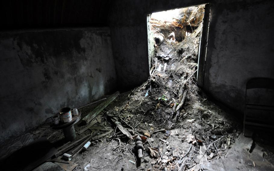 Dirt and debris have spilled into the doorway of what is believed to be a World War II-era, Japanese military bunker that was recently discovered on Misawa Air Base, Japan. The U.S. military is working with Japanese officials to renovate and preserve the site.